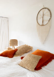raffia pillow on bed