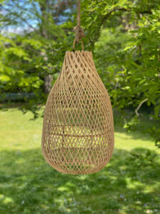 hanging natural woven lamp in tree
