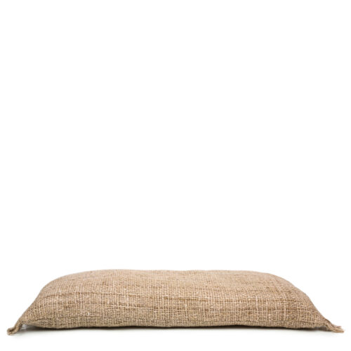 flat-lying elongated beige pillow