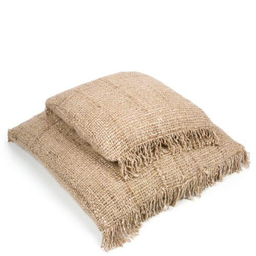 two pillows on top of each other of different sizes in woven beige cotton