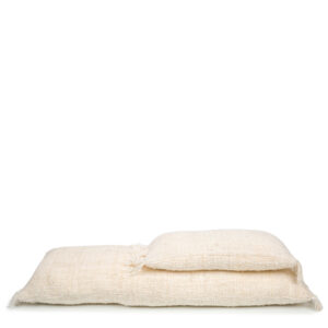 two different sizes of white pillows lying on top of each other