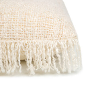 detail of woven cream pillow