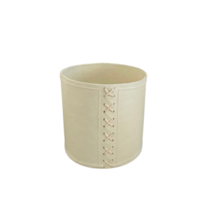 white flower pot with cross stitch photographed from above