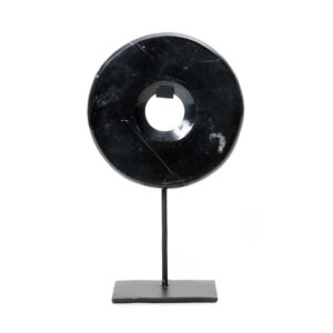black marble disc on stand