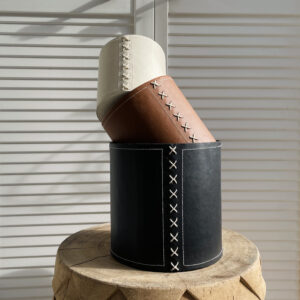 stacked flower pots in black, cognac and cream