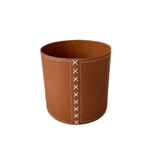 eco plant pot from above in cognac color with white cross stitch