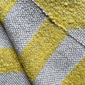 detail of striped plaid in ocre color