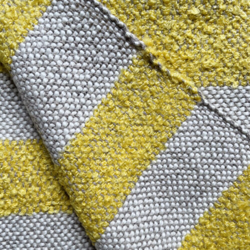 detail of striped plaid in ocre color