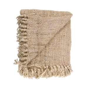 beige thrown blanketmade of cotton with a small fold