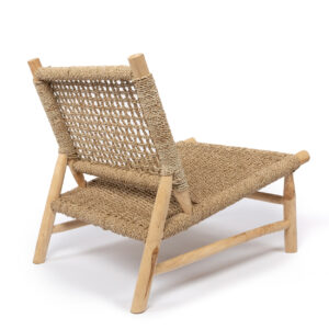 wooden lounge chair photographed diagonally from behind