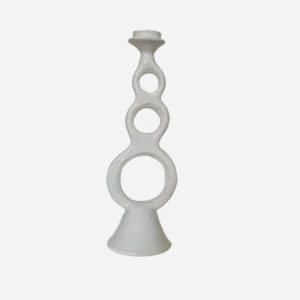 high white candle holder with three large round holes on white background