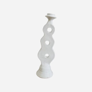 white candle holder with three holes