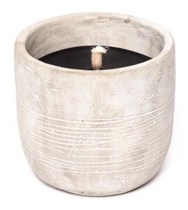 black candle in concrete pot on white background