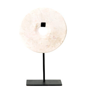 white marble decorative piece on a black stand