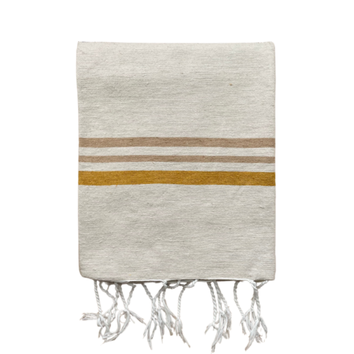 folded plaid in off-white with sand-colored and ocher stripes