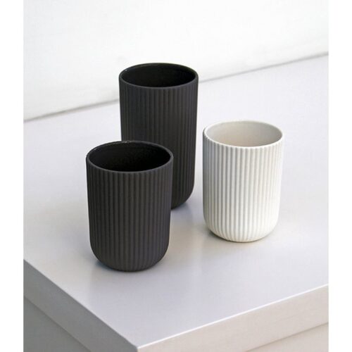 three mugs in gray and white on white background